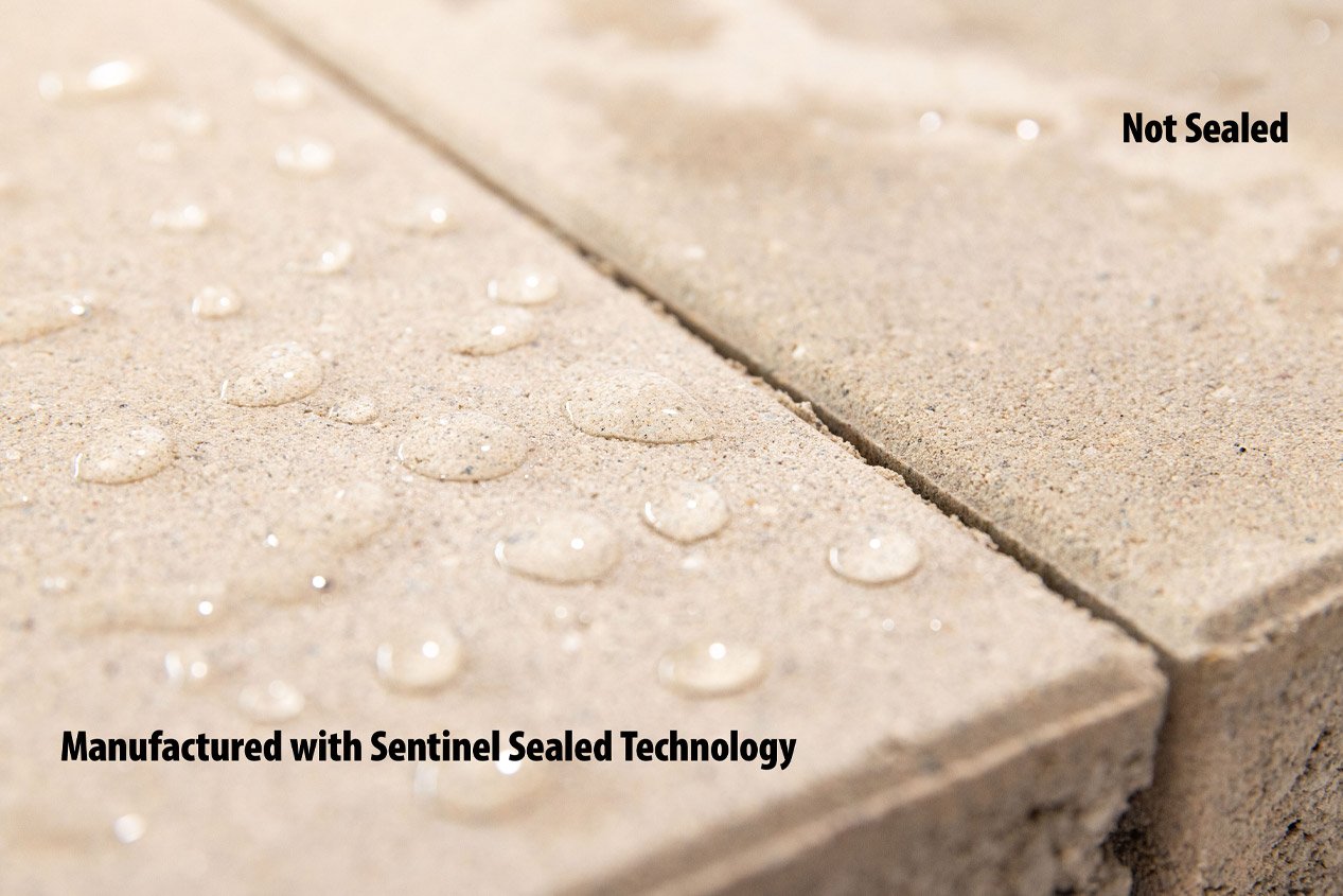 Two concrete pavers are shown, one with water droplets beaded up and not soaking into the paver surface, and one with a wet stain showing where water has absorbed into the paver.